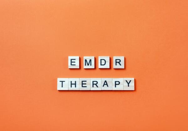 Words,emdr,therapy,from,wooden,blocks,with,letters,on,orange