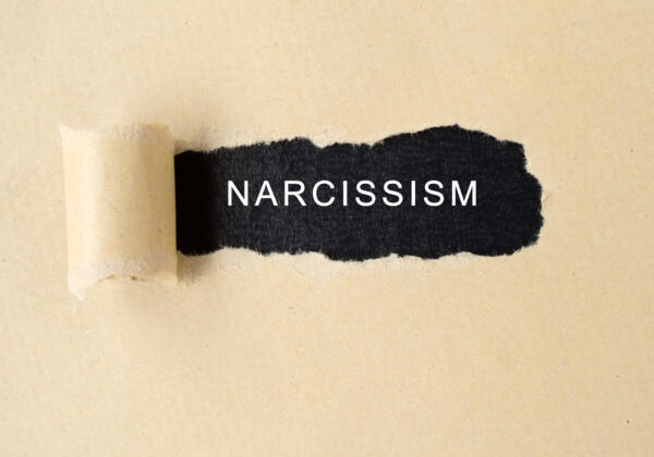 Narcissism,word,on,torn,paper